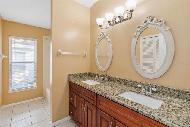 bathroom with tile patterned flooring, vanity, tub / shower combination, and a notable chandelier