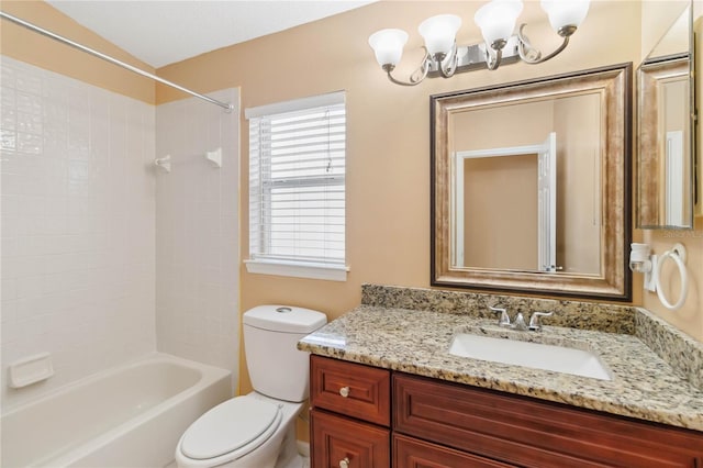 full bathroom with tiled shower / bath, vanity, toilet, and a notable chandelier