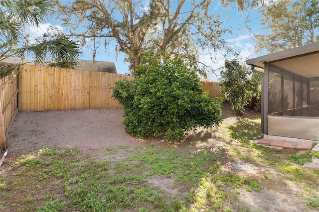 view of yard featuring a sunroom