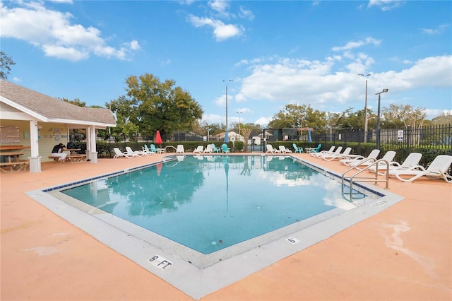 view of swimming pool featuring a patio area