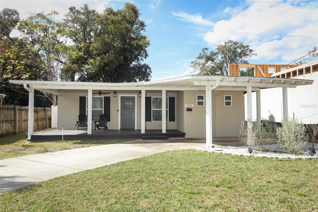 view of front of home featuring a porch and a front yard