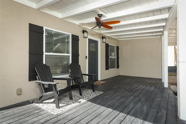 wooden terrace featuring ceiling fan