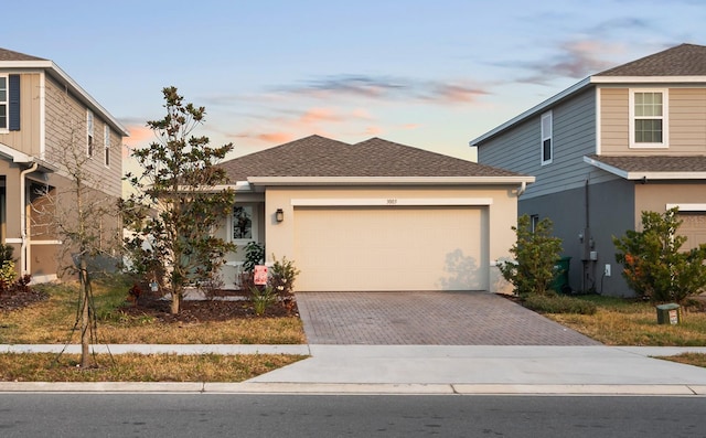 view of front of property with a garage