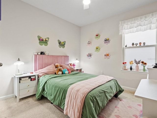 bedroom featuring light carpet and ceiling fan