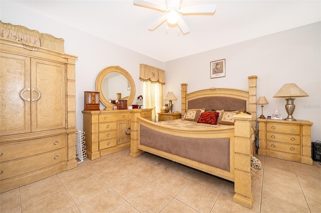 bedroom with ceiling fan and tile patterned flooring