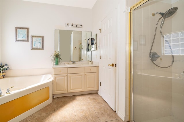 bathroom with shower with separate bathtub, tile patterned floors, and vanity