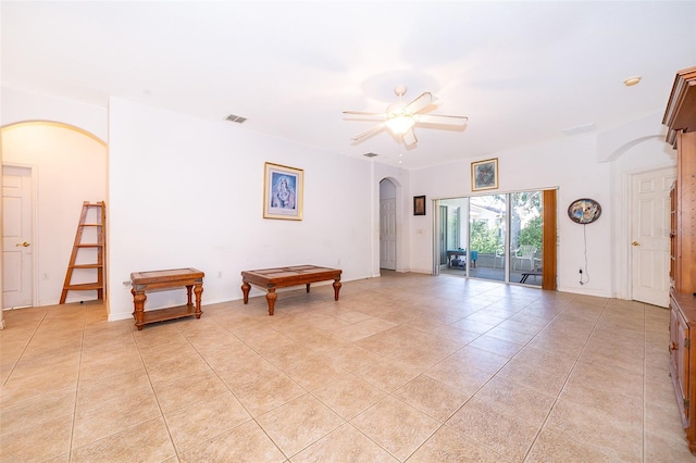 interior space with ceiling fan and light tile patterned floors