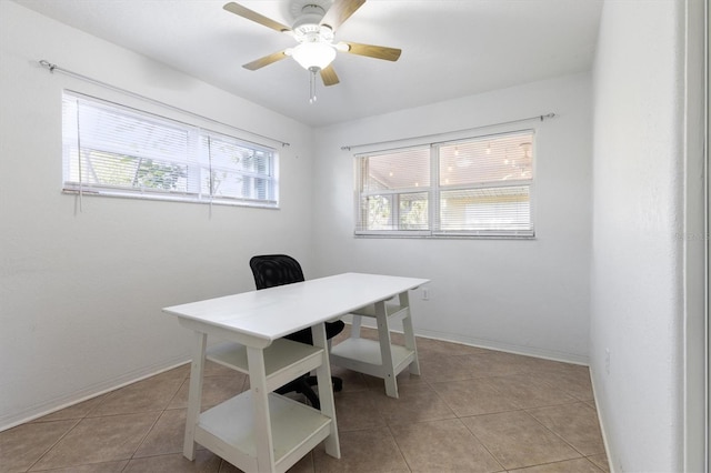 office space with ceiling fan and light tile patterned floors