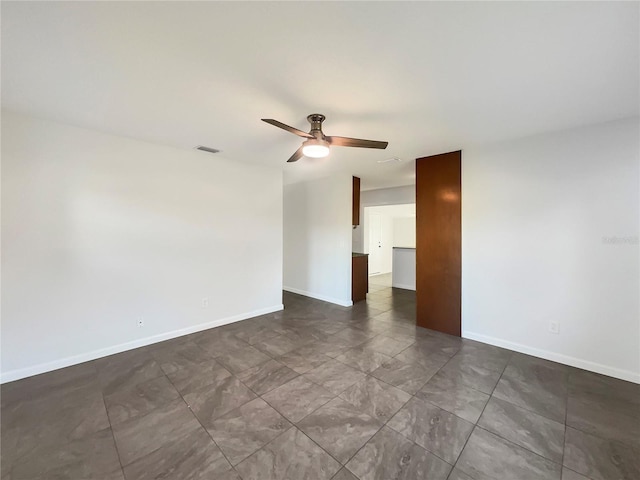 unfurnished room with ceiling fan