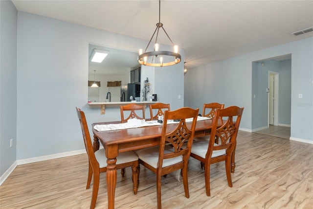 dining area with light hardwood / wood-style floors