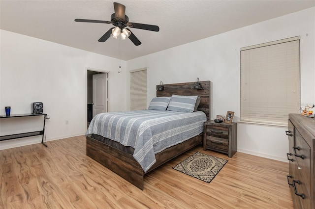 bedroom featuring ceiling fan and light hardwood / wood-style floors