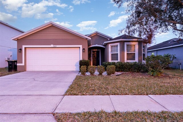 single story home with a garage