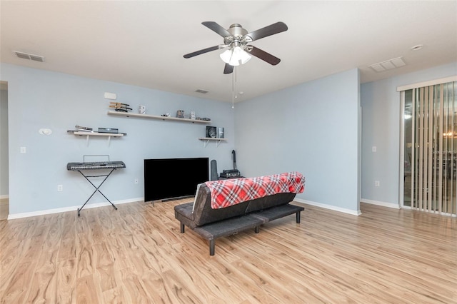 bedroom with light hardwood / wood-style floors and ceiling fan