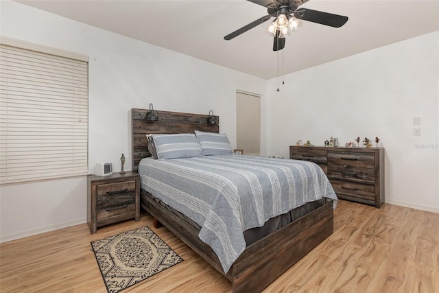 bedroom featuring ceiling fan and light hardwood / wood-style flooring