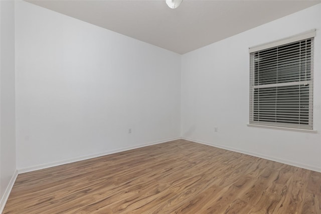 unfurnished room featuring light hardwood / wood-style floors