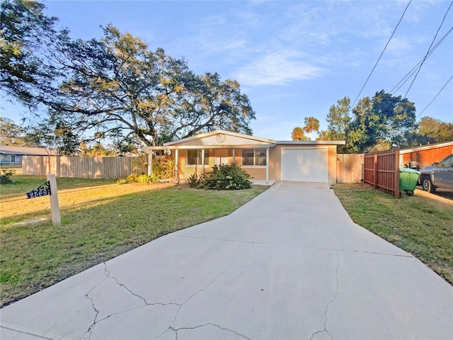 view of front of property with a garage and a front yard