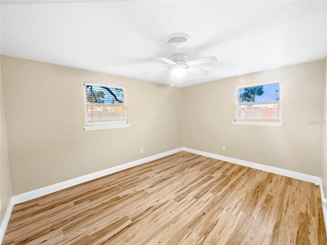 unfurnished room featuring ceiling fan and light hardwood / wood-style flooring