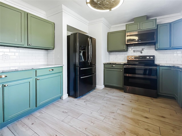 kitchen featuring crown molding, appliances with stainless steel finishes, backsplash, and light hardwood / wood-style floors