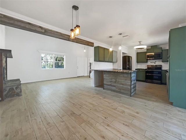 kitchen with double oven range, decorative light fixtures, crown molding, and green cabinetry