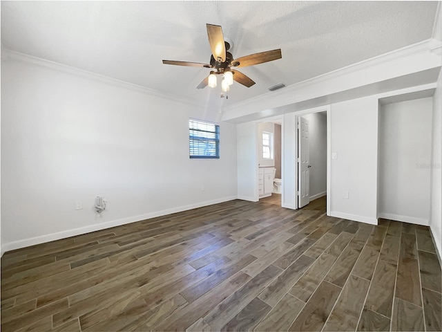 unfurnished bedroom with crown molding, dark hardwood / wood-style floors, ceiling fan, and ensuite bathroom