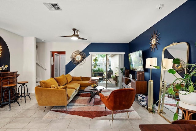 living room featuring ceiling fan and light tile patterned floors