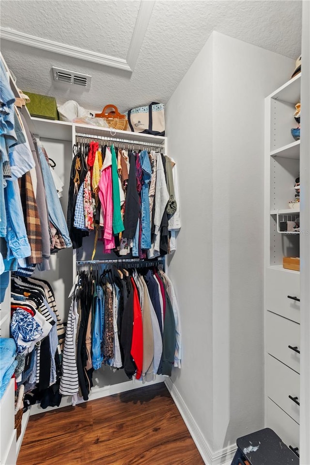 spacious closet with wood finished floors and visible vents