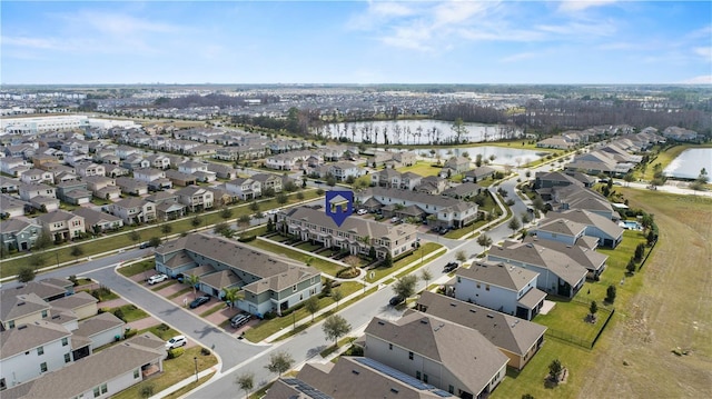 bird's eye view with a water view and a residential view