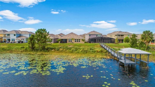 dock area with a water view and a residential view