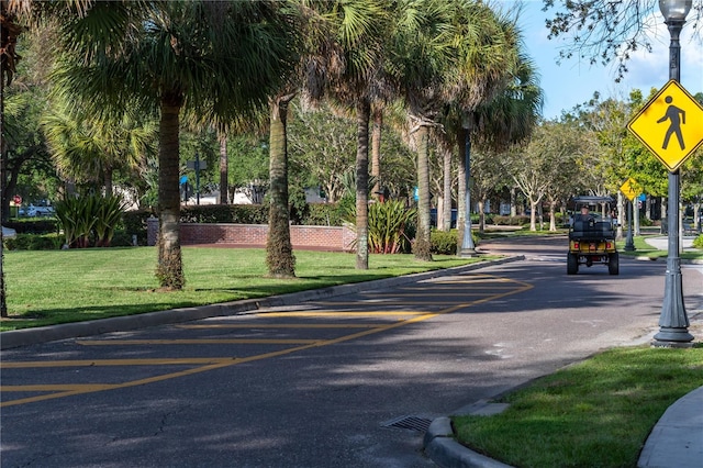 view of property's community featuring a yard