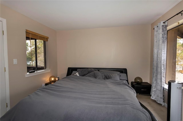 bedroom with light tile patterned flooring