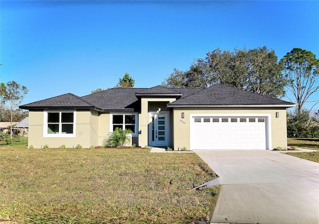 view of front facade with a garage and a front yard