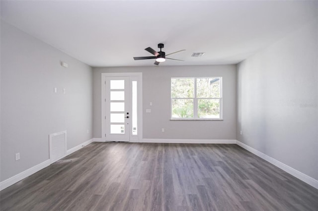 unfurnished room featuring dark hardwood / wood-style floors and ceiling fan