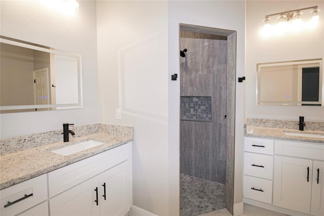 bathroom featuring vanity and a tile shower