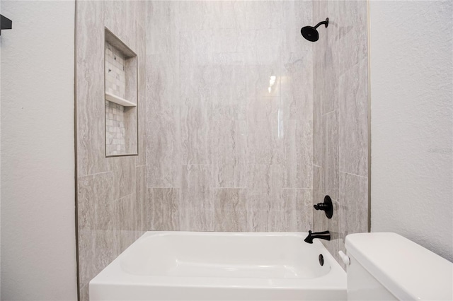 bathroom featuring toilet and shower / bathing tub combination