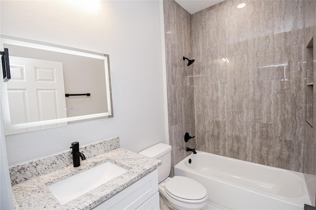 full bathroom featuring vanity, bathtub / shower combination, and toilet