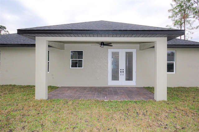 back of house with french doors, ceiling fan, a yard, and a patio area