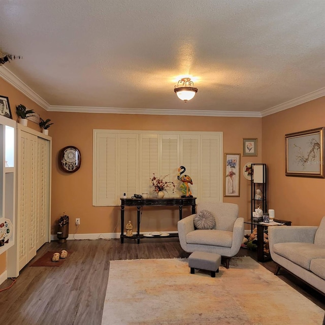 living room featuring crown molding, dark hardwood / wood-style floors, and a textured ceiling