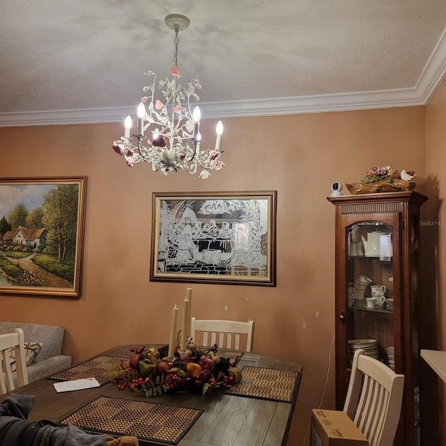 dining area with ornamental molding and a chandelier