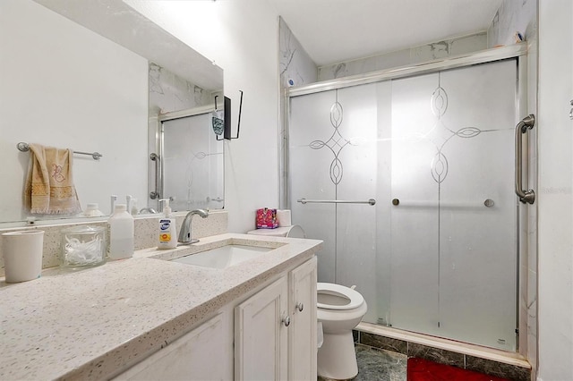 bathroom with vanity, walk in shower, and toilet