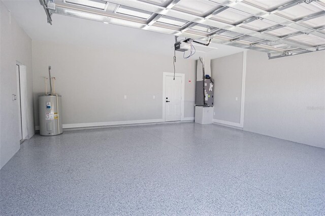 garage with a garage door opener and water heater