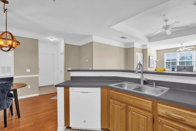 kitchen featuring sink, dishwasher, ornamental molding, decorative light fixtures, and light wood-type flooring