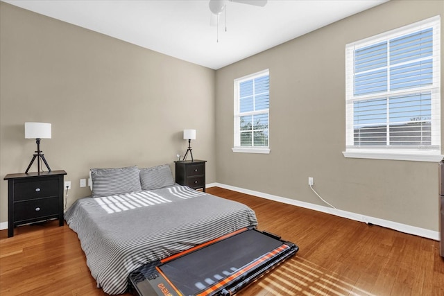 bedroom featuring wood-type flooring and ceiling fan