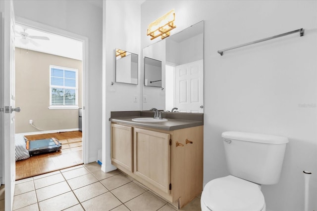 bathroom featuring vanity, ceiling fan, tile patterned floors, and toilet