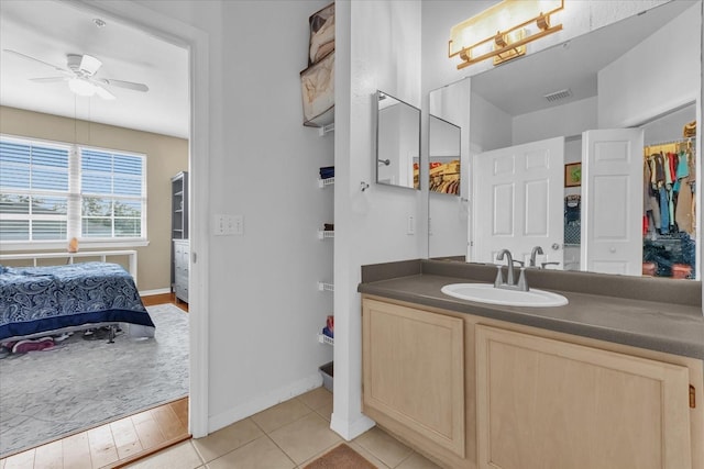 bathroom featuring vanity, tile patterned floors, and ceiling fan