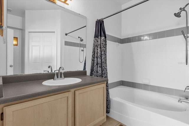 bathroom with vanity and shower / bathtub combination with curtain