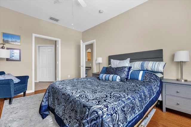 bedroom featuring light hardwood / wood-style floors and ceiling fan