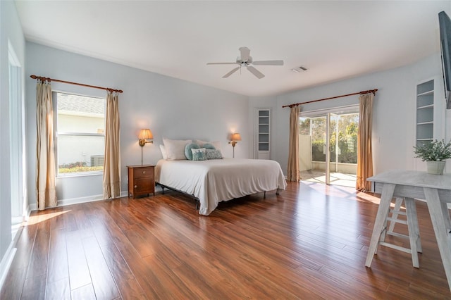 bedroom featuring dark hardwood / wood-style floors, access to outside, and ceiling fan