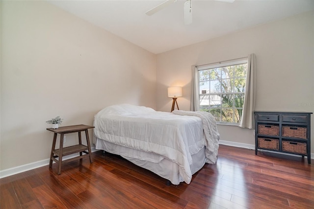 bedroom featuring ceiling fan and dark hardwood / wood-style flooring