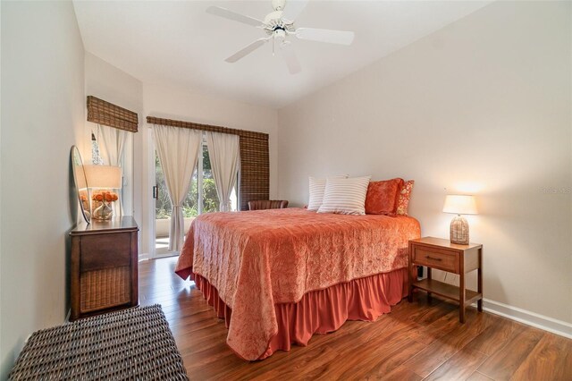 bedroom with ceiling fan, dark hardwood / wood-style flooring, and access to exterior