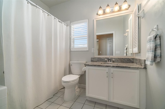 bathroom with vanity, a shower with curtain, tile patterned floors, and toilet